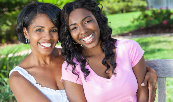 mom and daughter smiling after their visit to the dentist