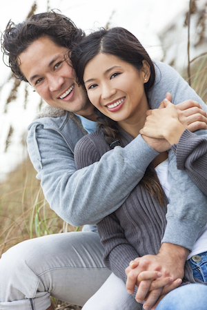 couple smiling after visiting the oral surgeon for a consultation