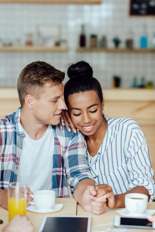 couple smiling after whitening their teeth